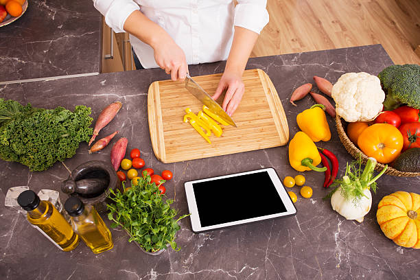 istock Woman cutting vegetable in pieces 505476146