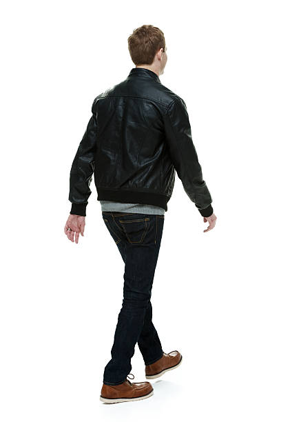 istock Rear view of man in jacket & walking 505482871