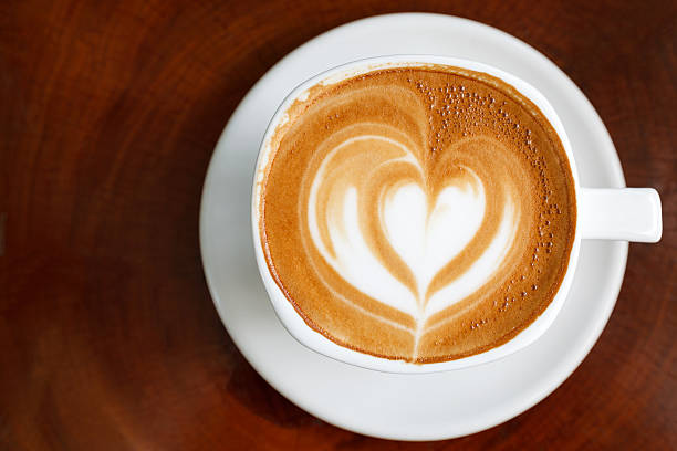 istock Cup of latte coffee on wooden 505483499