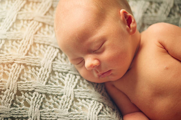 istock Dreaming Newborn Baby - naked 505483655