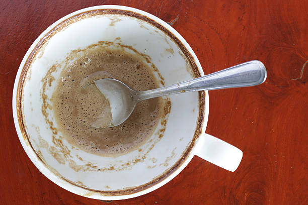 istock Dregs in the bottom of the cup on wood 505483873