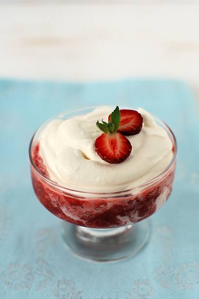 istock Strawberry with cream in a glass vase 505483907