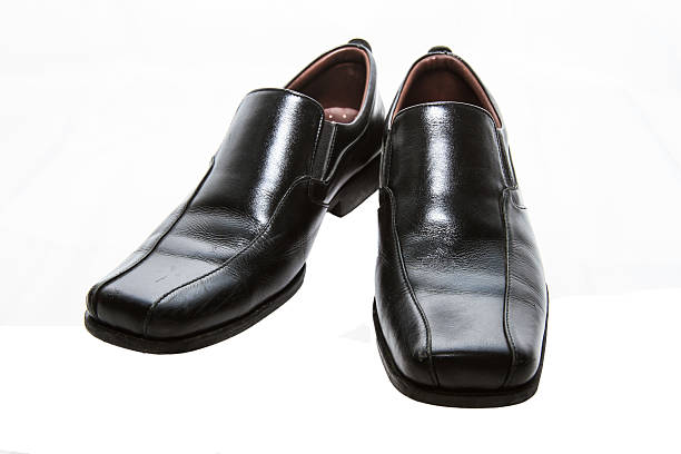 istock The leather shoes on white isolated background 505486981