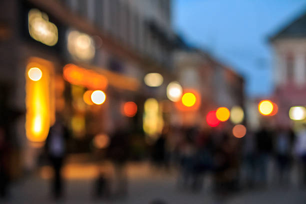 istock crowd  moving on old city night street blurred 505487097