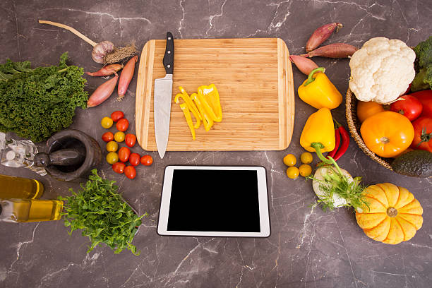 istock Preparation table in kitchen for cooking with portable device 505487338