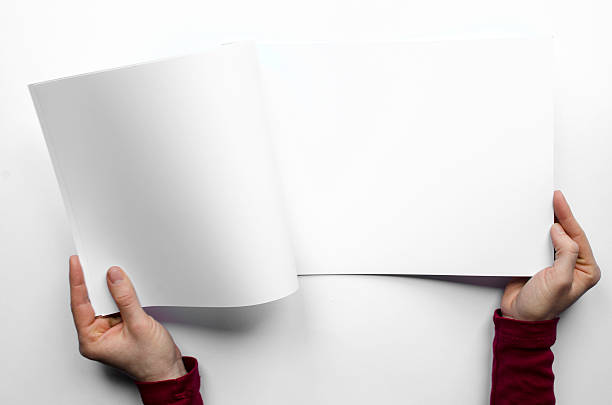 istock Opening a blank magazine seen from above 505487912