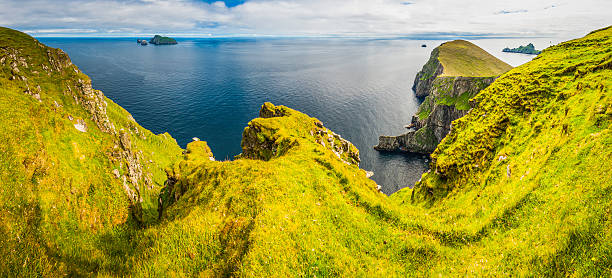istock Island cliffs wild blue ocean rocky shore St Kilda Scotland 505488214