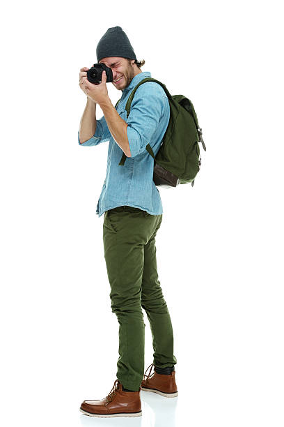 istock Smiling photographer in action 505489276