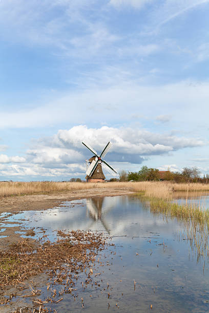Windmills As Part Of Holland Farmhouses In Rural Areas, The Netherlands