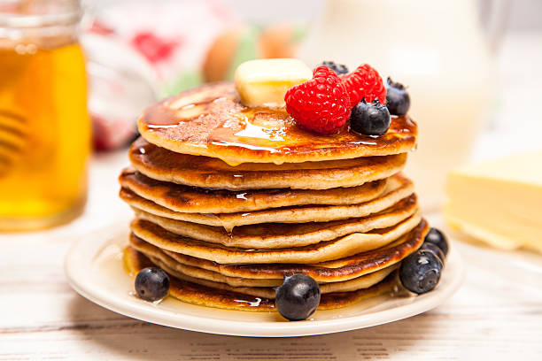 istock High pile of delicious pancakes 505490302