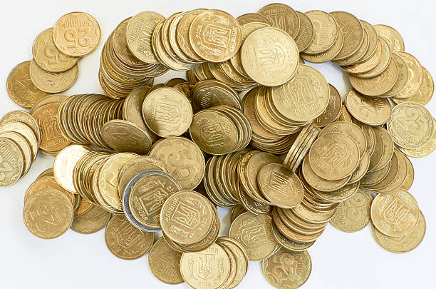 istock golden coins isolated on white. Ukrainian coins 505490882