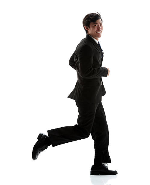 istock Smiling businessman running 505491224