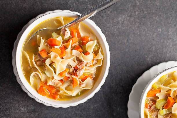 istock Turkey noodle soup top view macro shot 505492700