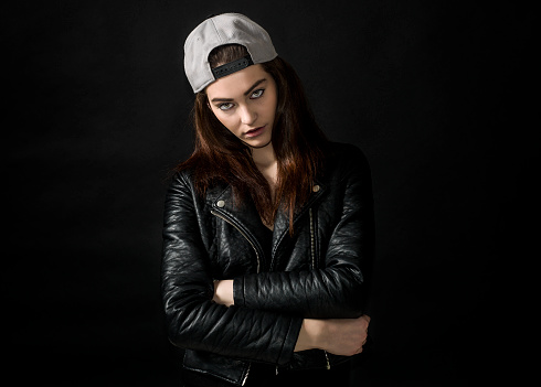 Beautiful girl portrait wearing leather jacket and basket cap