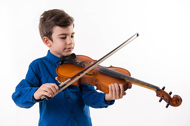 istock little handsome boy with the violin 505494714