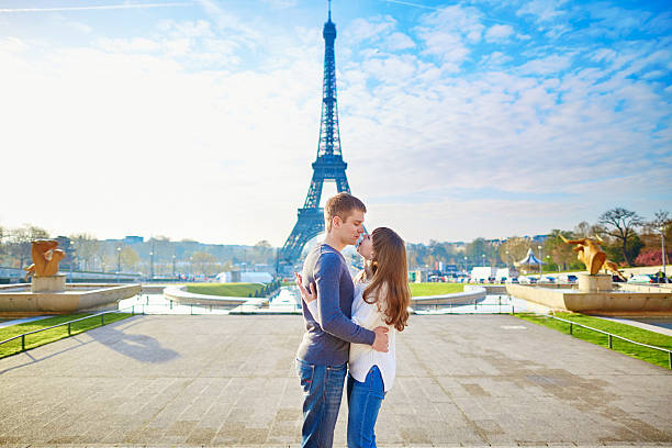 istock Couple holding hands near the Eiffel tower 505495860