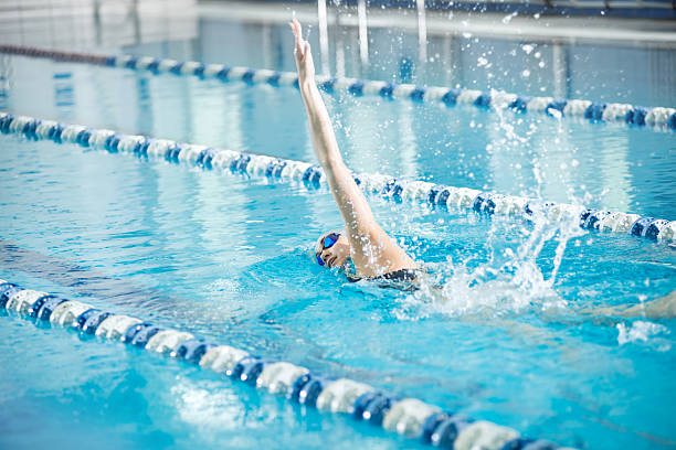 istock Young girl in goggles swimming front crawl stroke style 505496756