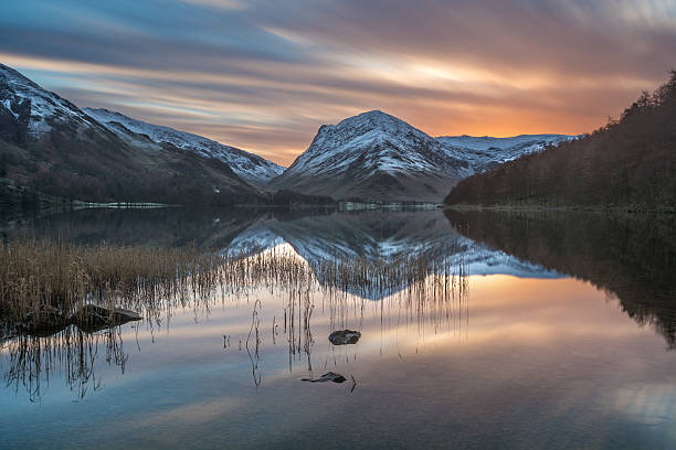 istock Vibrant Sunrise At Buttermere With Snowy Mountain Reflections. 505496828