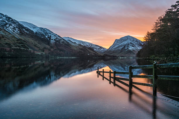 istock Beautiful Tranquil Scene At Buttermere With Orange Sunrise Sky. 505497110