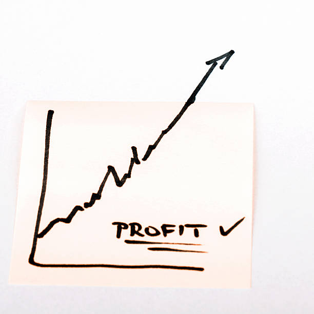 istock note paper with finance business graph going up - profit 505497388