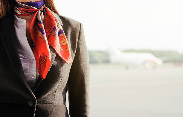 istock Stewardess on the airfield. Place for your text. 505500437