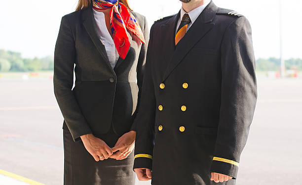 istock Pilot and stewardess on the airfield. 505500443
