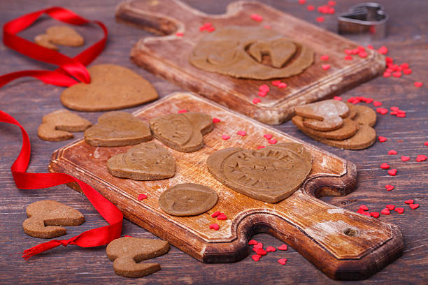 istock Heart shaped valentine gingerbread on a wooden board 505500774