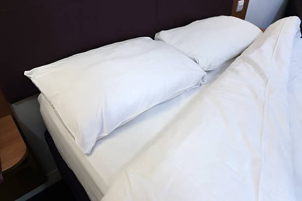 istock bed in the hotel room 505500856
