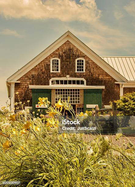 New England Farm House With Tiger Lillies In The Foreground Stock Photo - Download Image Now