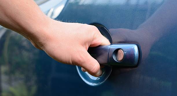 istock Hand opening car door 505506977