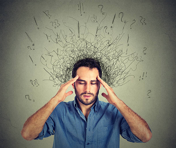 man with stressed face expression brain melting into lines stock photo