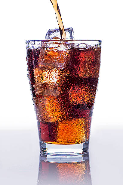 istock Pouring soft drink in a glass with ice 505508948