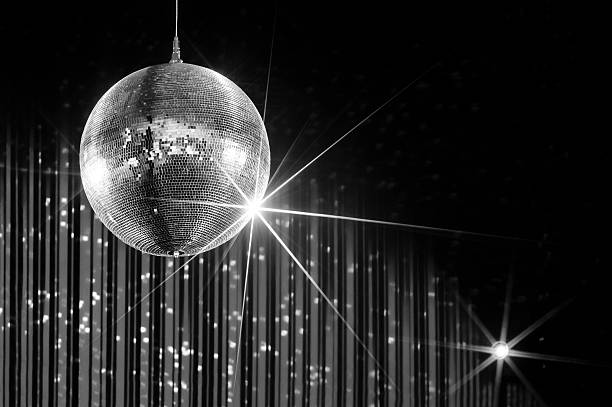 Party disco ball Party disco ball with stars in nightclub with striped walls lit by spotlight, nightlife entertainment industry, monochrome  evening ball photos stock pictures, royalty-free photos & images
