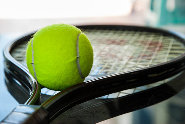 istock Tennis ball on a racket 505510108