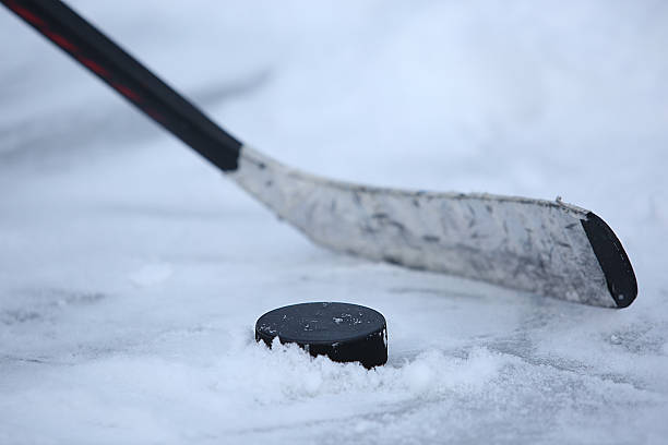 istock Hockey Stick and Puck 505510142