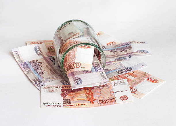 istock Money in a glass bowl 505511252