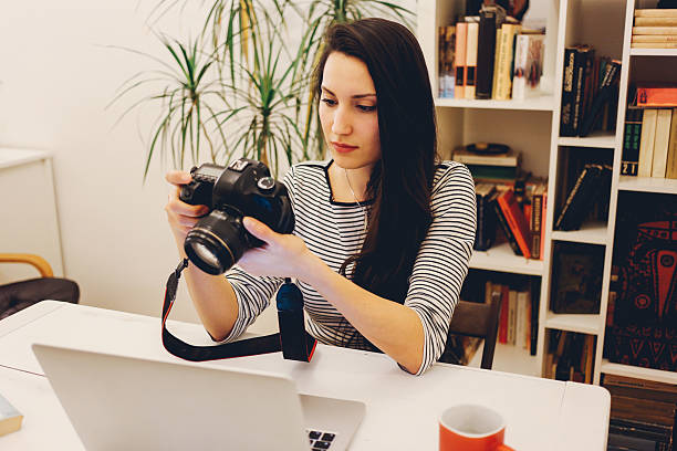 istock Young photographer working on the laptop 505511748
