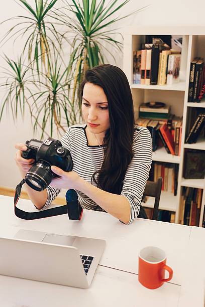 istock Young photographer working on the laptop 505511920