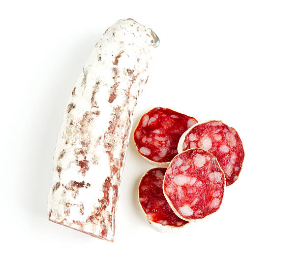 dried sliced salami isolated on white dried sliced salami isolated on white sliced salami stock pictures, royalty-free photos & images