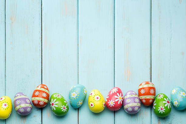 Beautiful Easter Eggs on a Retro Powder Blue Wood background.