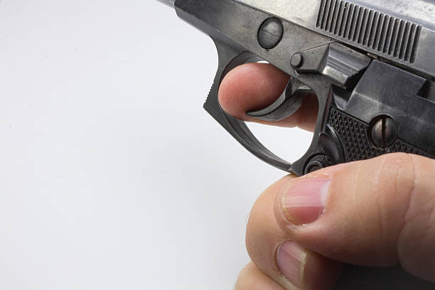 istock semiautomatic pistol in a hand with white background 505517331