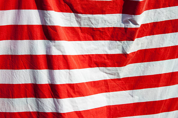 istock Red and white stripes background in the wind 505518259