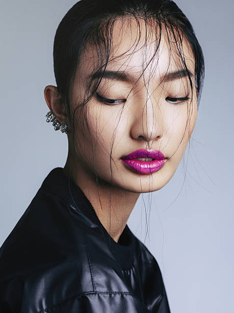 Asian beauty Portrait of fashionable asian woman with statement ear cuff. Professional make-up and hairstyle. High-end retouch. asian american model stock pictures, royalty-free photos & images