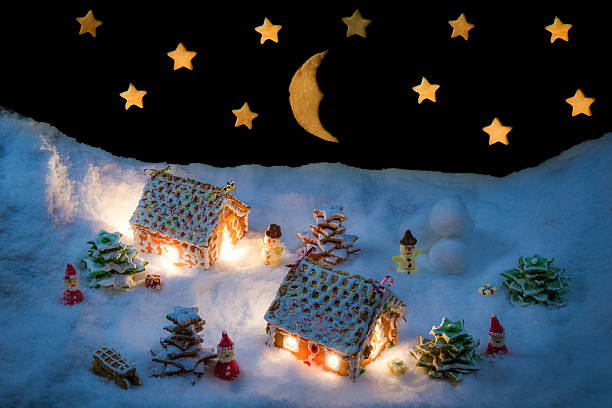istock Snowy gingerbread village with stars and moon 505519359