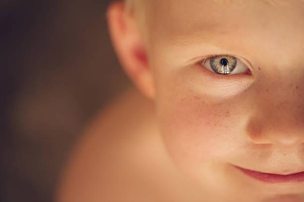 istock Cute young boy looking up with blond hair 505519967