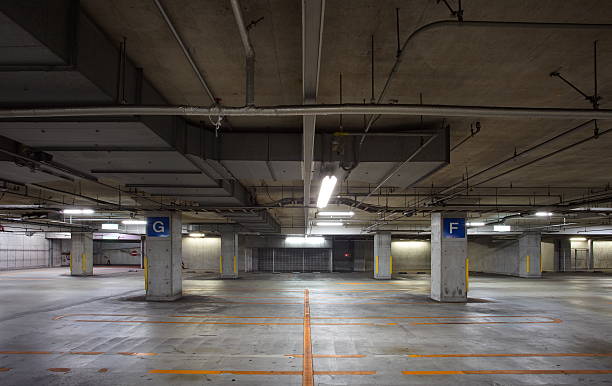 istock Parking garage  interior, neon lights in dark 505520849