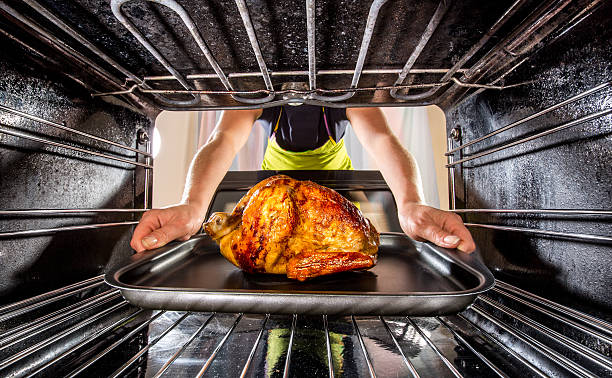 istock Cooking chicken in the oven at home. 505520947