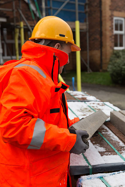 istock Male builder working at house site in UK 505521292