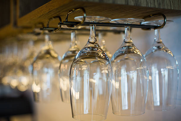 istock Glasses hanging over a bar 505521722