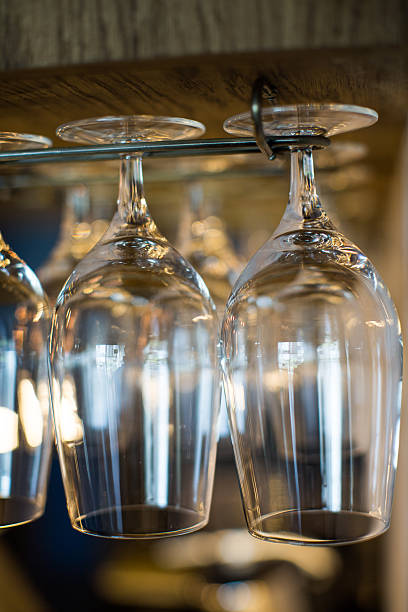istock Glasses hanging over a bar 505521798